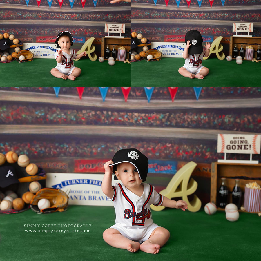 Peachtree City baby photographer, playing with a hat during a baseball studio session