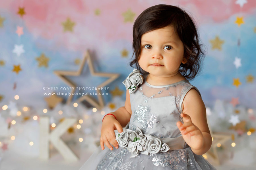 Newnan baby photographer, girl in silver dress for star theme milestone session