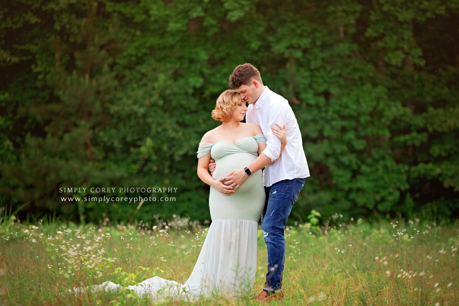 Newnan maternity photographer, couple outside in green summer field