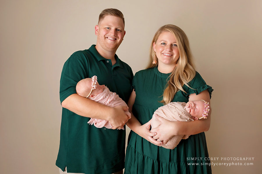 Douglasville family photographer, parents with newborn twin baby girls in pink