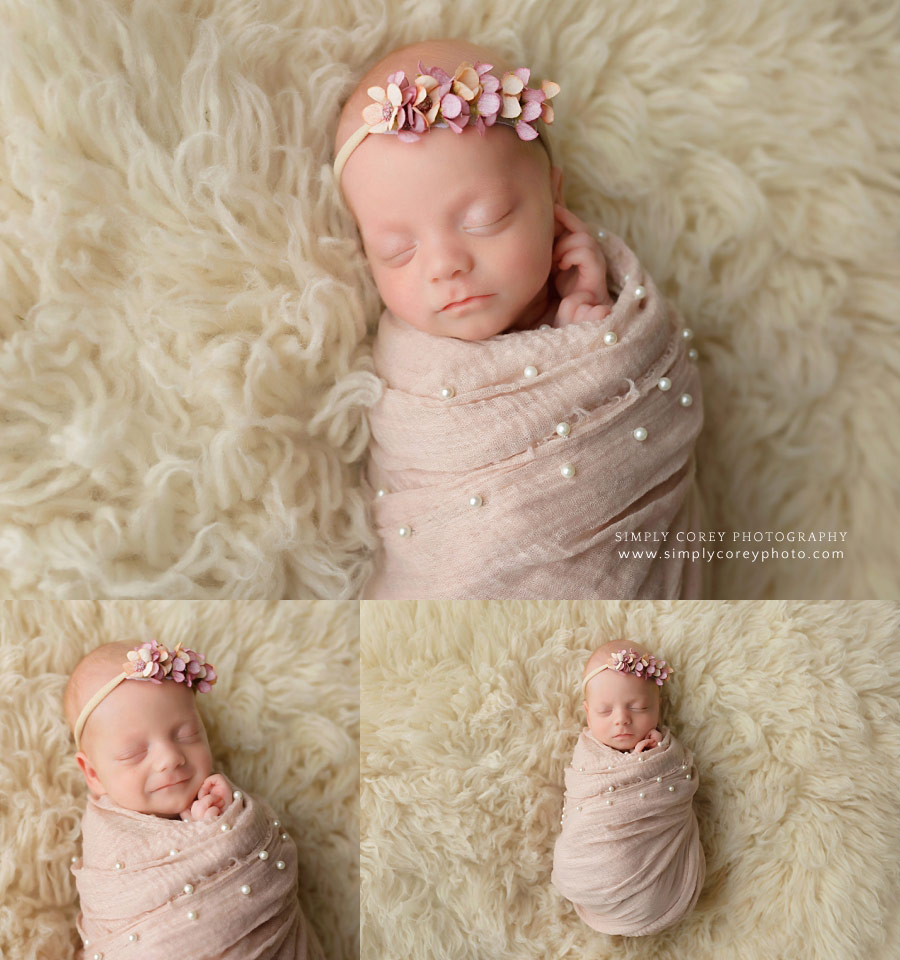 newborn photographer near Carrollton, GA; baby girl in pink wrap with pearls