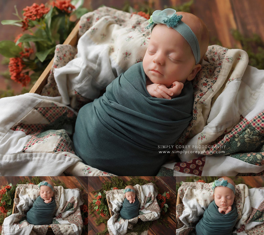 newborn photographer near Peachtree City, baby girl in teal swaddle