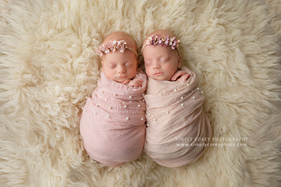 Villa Rica newborn photographer, baby girl twins in pink wraps on fur