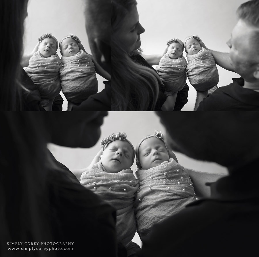 West Georgia family photographer, parents holding newborn twins in black and white