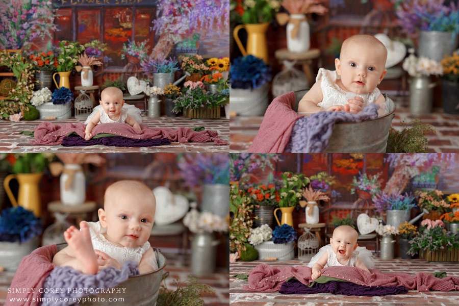 Bremen baby photographer, 5 month old in bucket with flowers