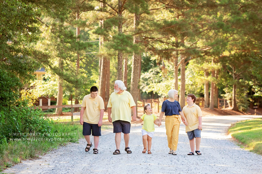 family photographer near Peachtree City, grandparents and grandchildren walking outside