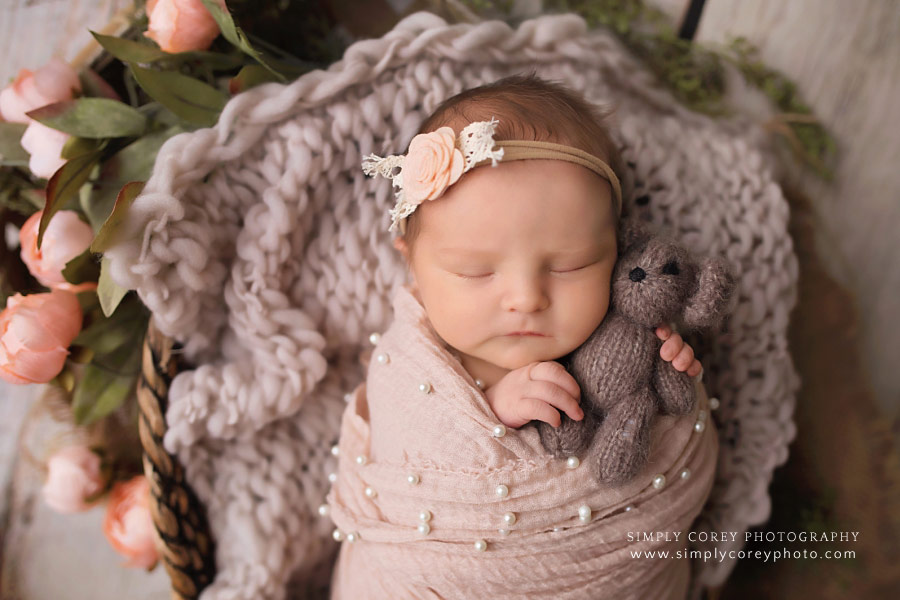 Atlanta newborn photographer; baby girl with teddy bear and pearl layer