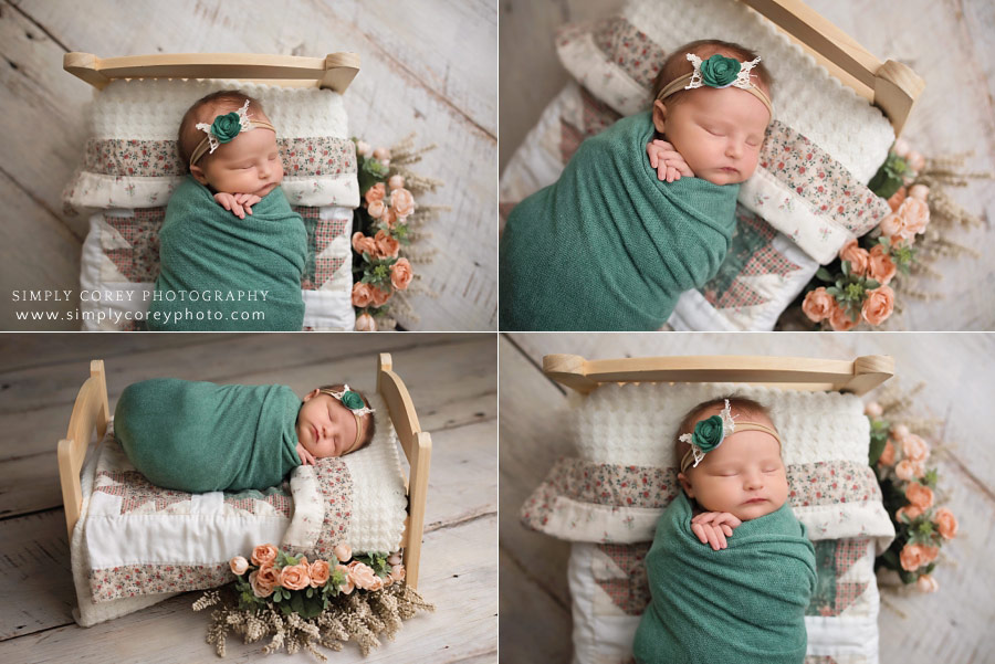 Villa Rica newborn photographer, baby in teal on bed with quilt and flowers