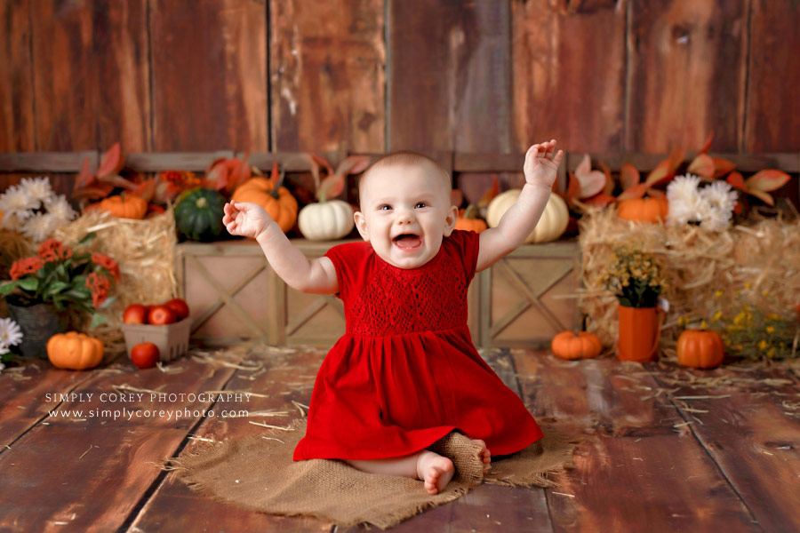 baby photographer near Douglasville, 7 month girl in red dress for fall milestone session