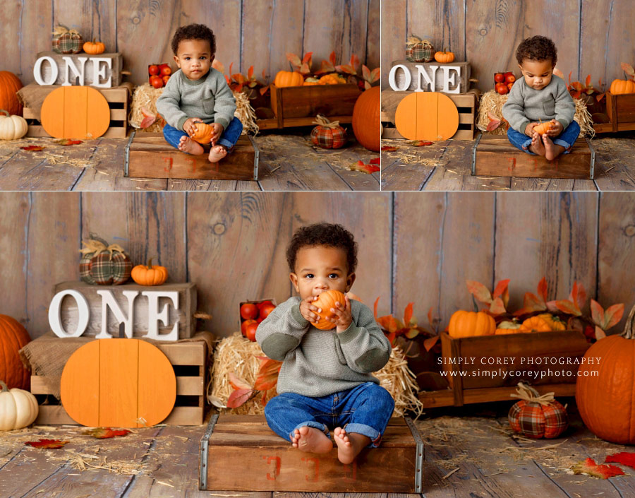 baby photographer near Hiram, toddler holding mini pumpkin for fall