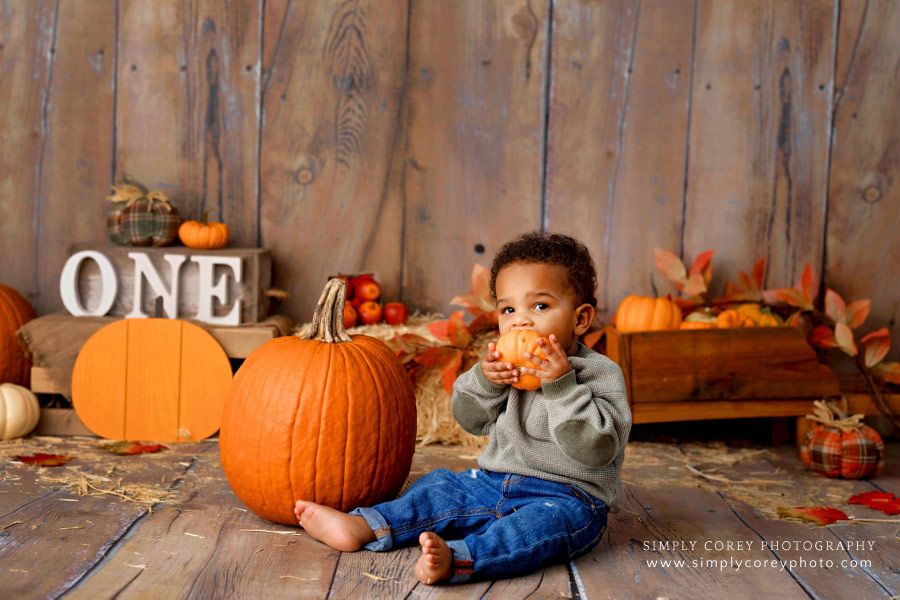 baby photographer near Villa Rica, fall one year milestone studio session with pumpkins