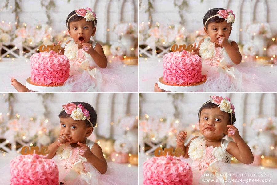 baby photographer near Newnan, girl eating pink ombre cake during cake smash 