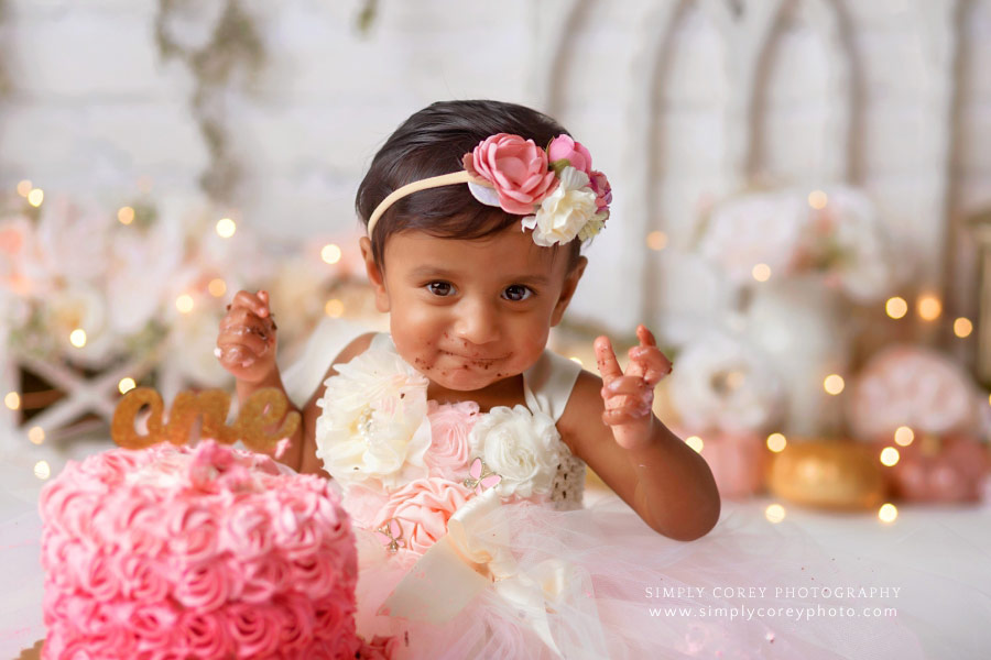 baby photographer near Villa Rica, pink ombre cake smash with pumpkins in studio