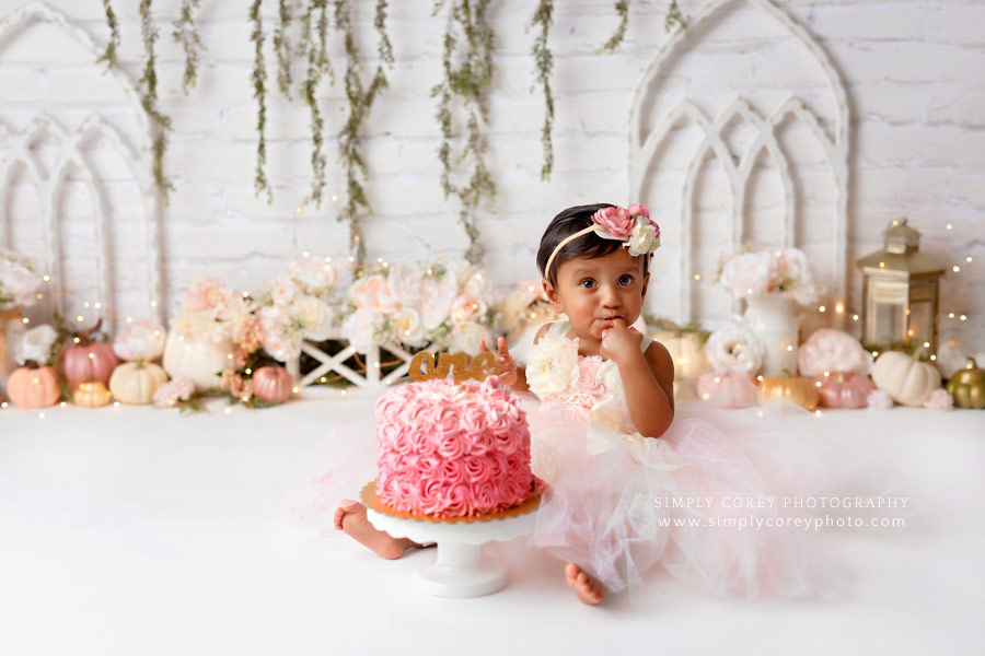 Newnan cake smash photographer, baby girl with pink ombre cake and pumpkins