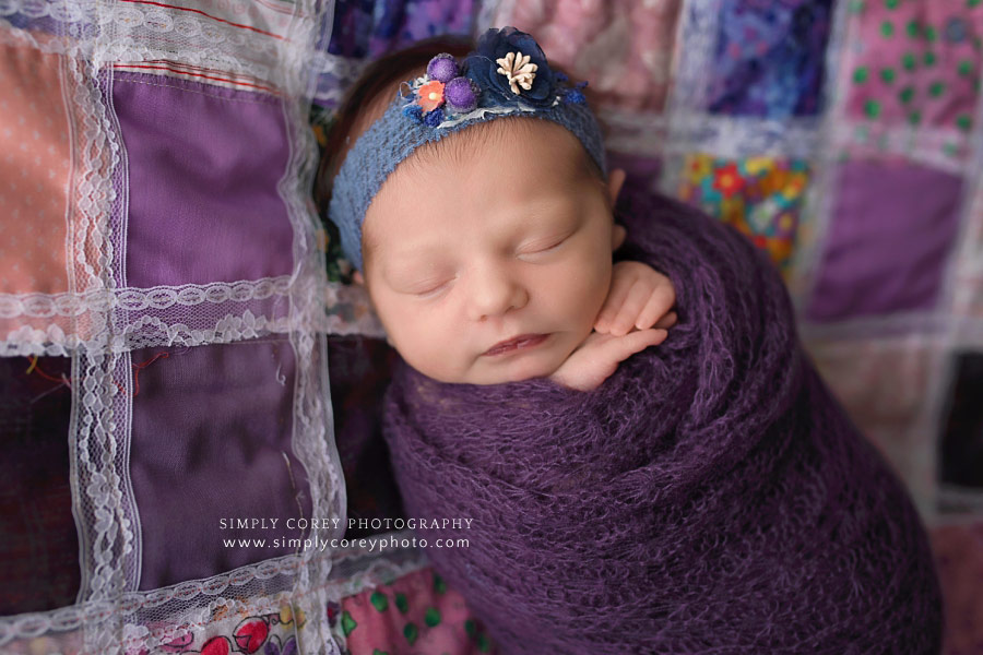Bremen newborn photographer, baby girl in purple on homemade quilt
