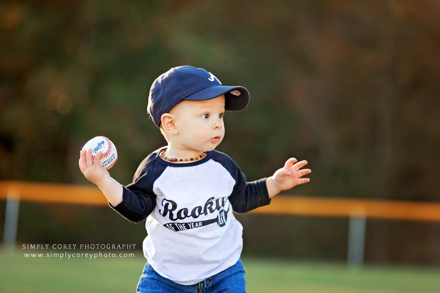 baby photographer near Atlanta, boy holding baseball in a rookie shirt