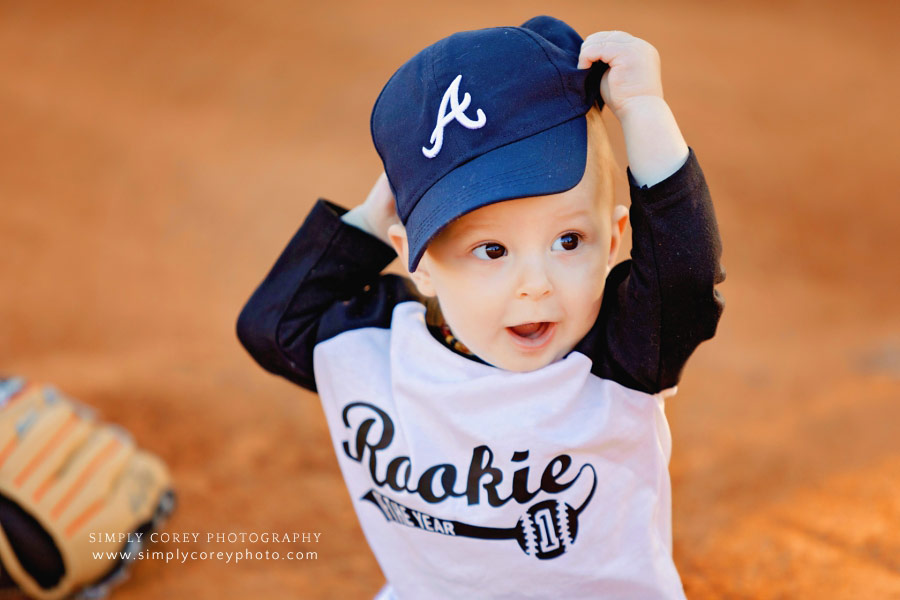 baby photographer near Dallas, GA; one year old boy in Atlanta Braves hat