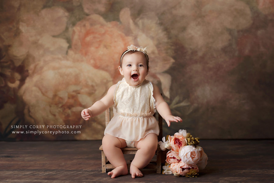 Newnan baby photographer, girl smiling during studio sitter session