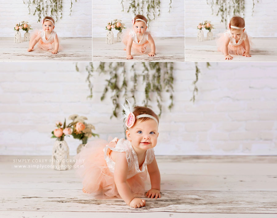 Carrollton baby photographer in Georgia, girl on simple white and floral studio set 