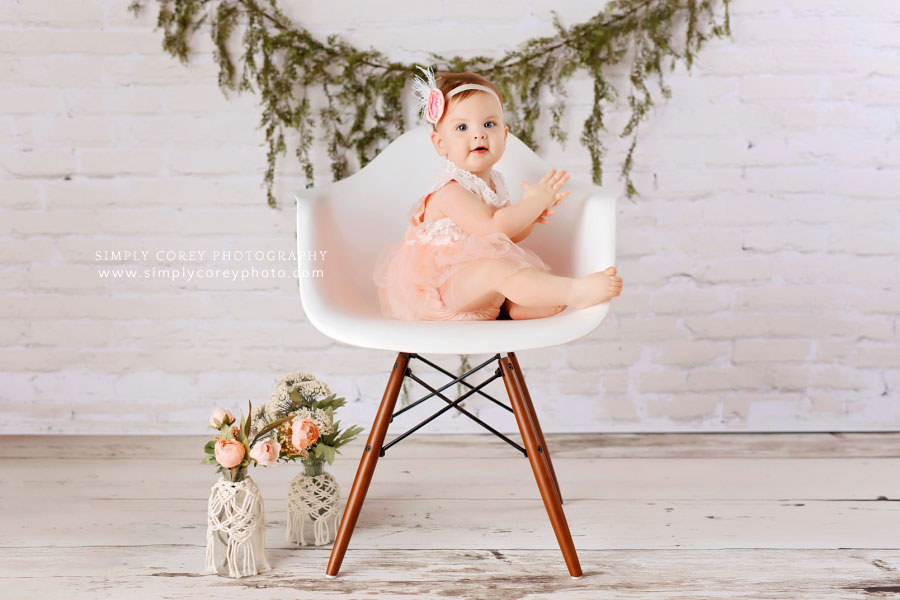 Peachtree City baby photographer, one year studio session with white brick and chair