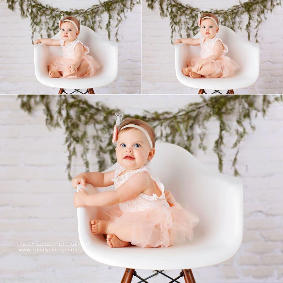 Villa Rica baby photographer, one year studio session with white brick and chair