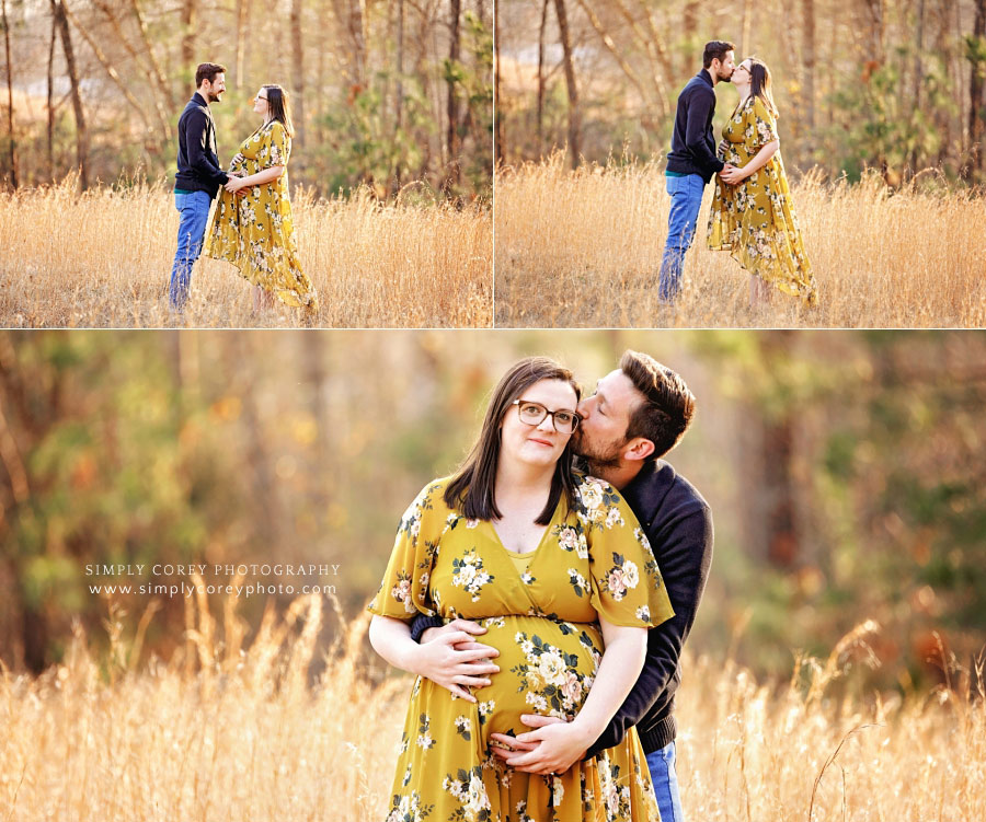 Atlanta maternity photographer, couple kissing outside in field