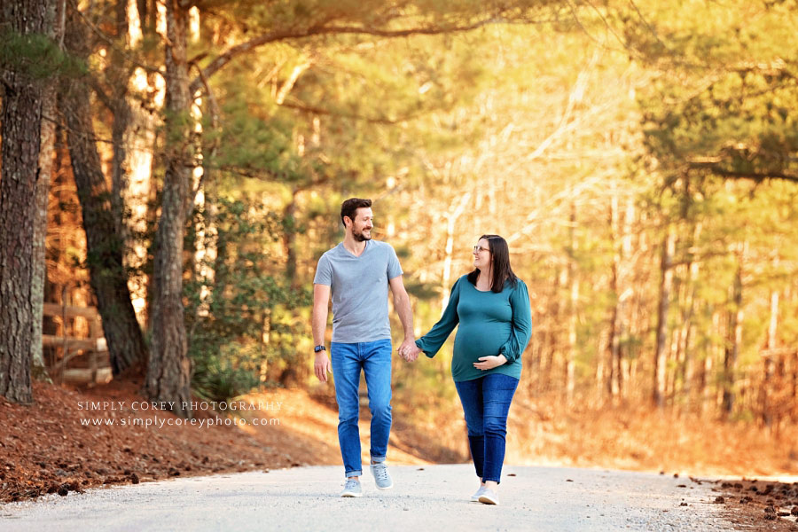 Peachtree City maternity photographer, couple walking on country road
