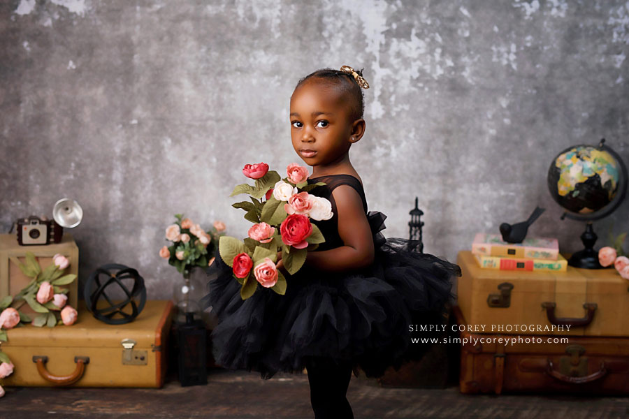 Atlanta baby photographer, girl in black dress with flowers for two year portraits