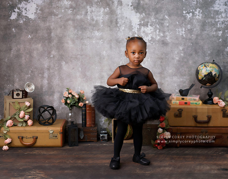 baby photographer near Douglasville, toddler in black tulle dress in studio
