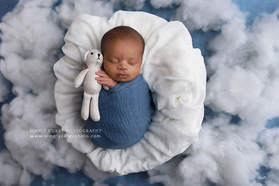 newborn photographer near Dallas, GA; baby boy in blue with teddy bear