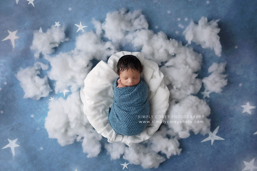 newborn photographer near Atlanta, baby boy in blue with clouds and stars