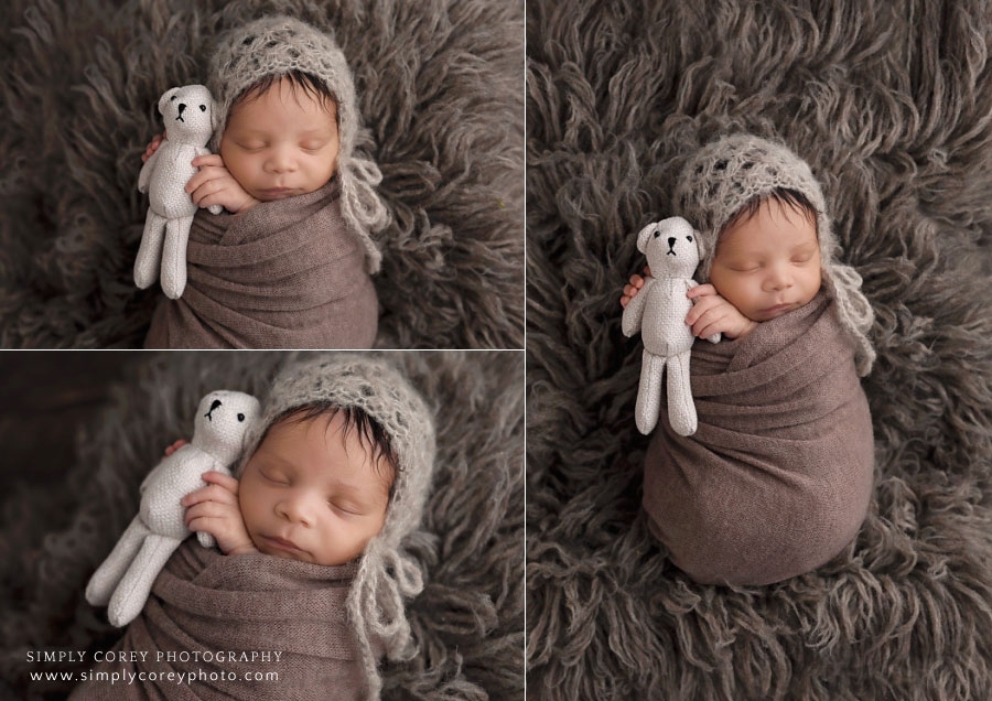 newborn photographer near Peachtree City, baby boy in hat holding a teddy bear
