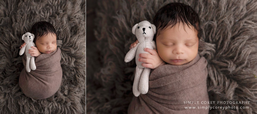 Villa Rica newborn photographer, baby boy in brown holding a teddy bear
