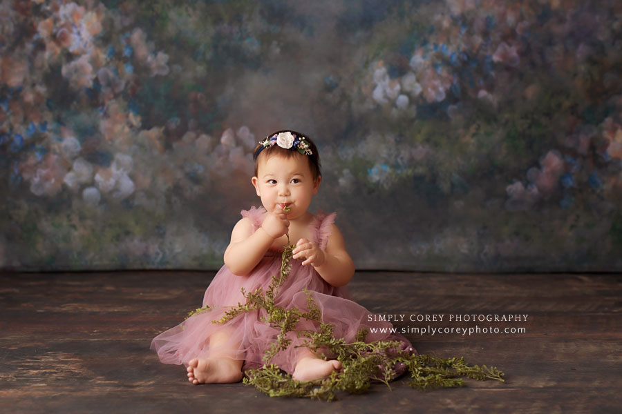 baby photographer near Atlanta, girl in tulle dress for sitter session with greenery