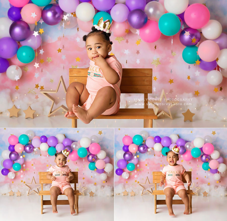 baby photographer near Dallas, GA; one year old on bench with balloons and stars
