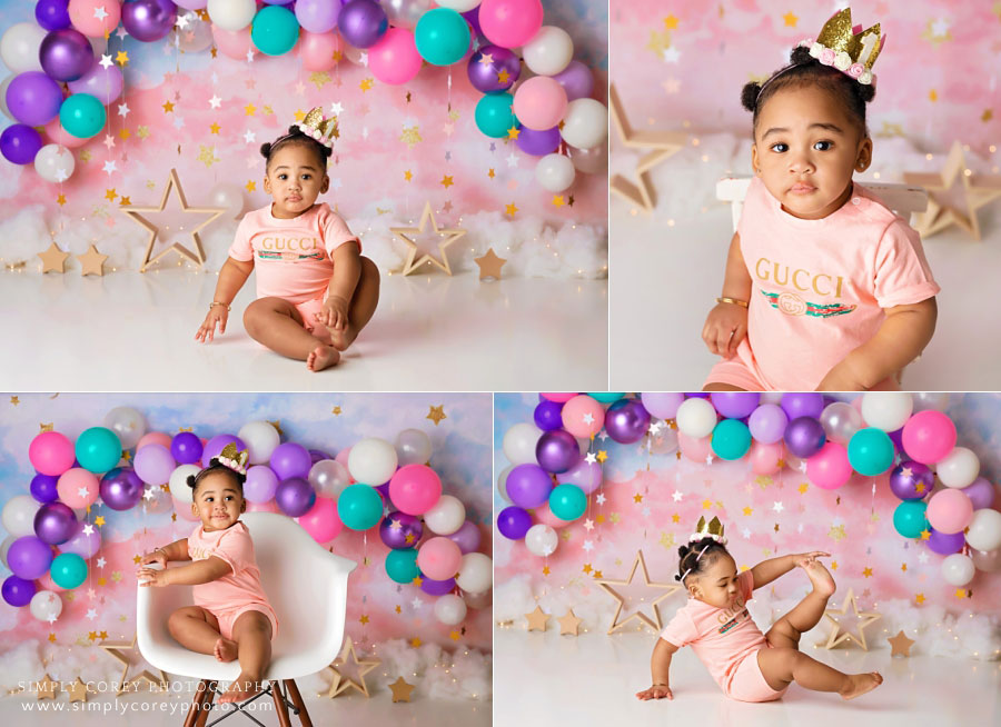 Newnan baby photographer, girl in Gucci romper with balloon garland and stars
