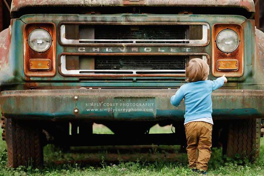 Carrollton kids photographer in Georgia, toddler outside by vintage Chevrolet truck