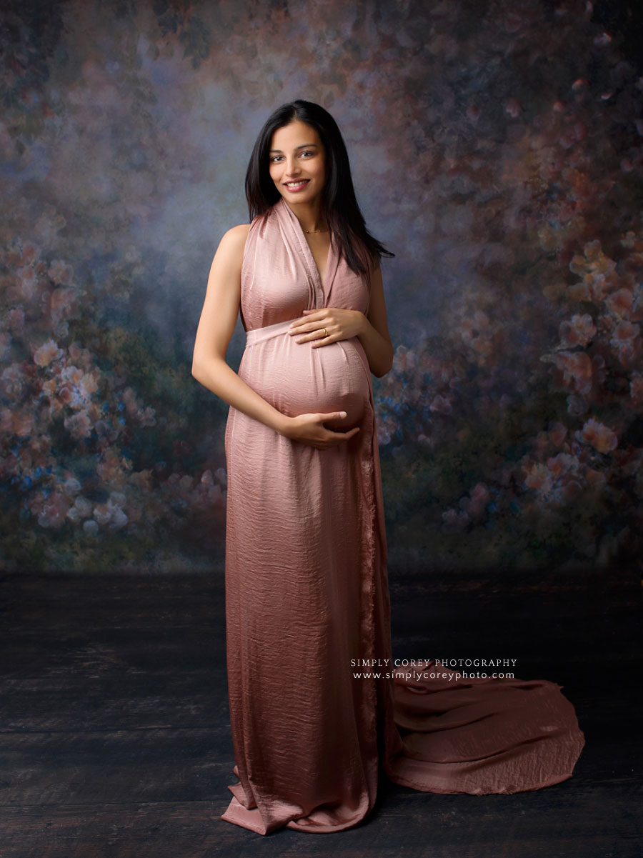 maternity photographer near Peachtree City, studio pregnancy portrait with floral backdrop