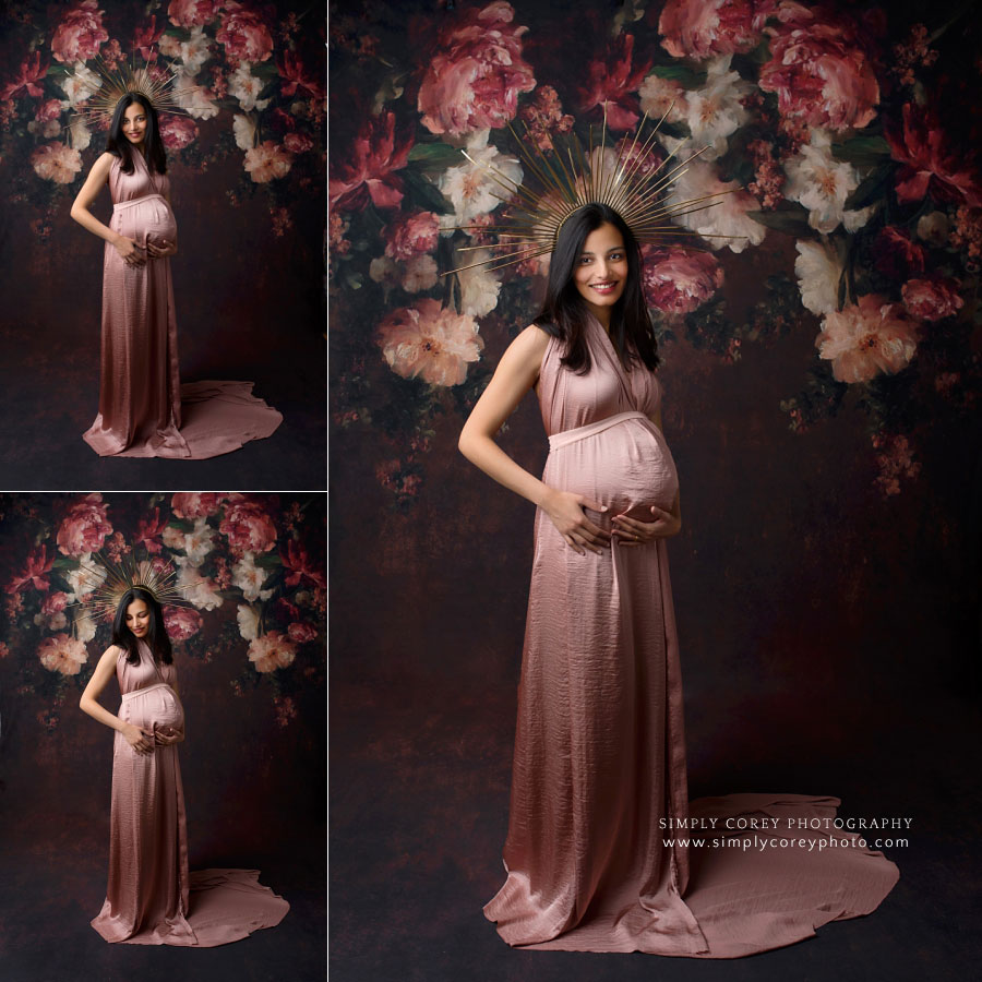 maternity photographer near Villa Rica, studio session with pink dress and floral backdrop