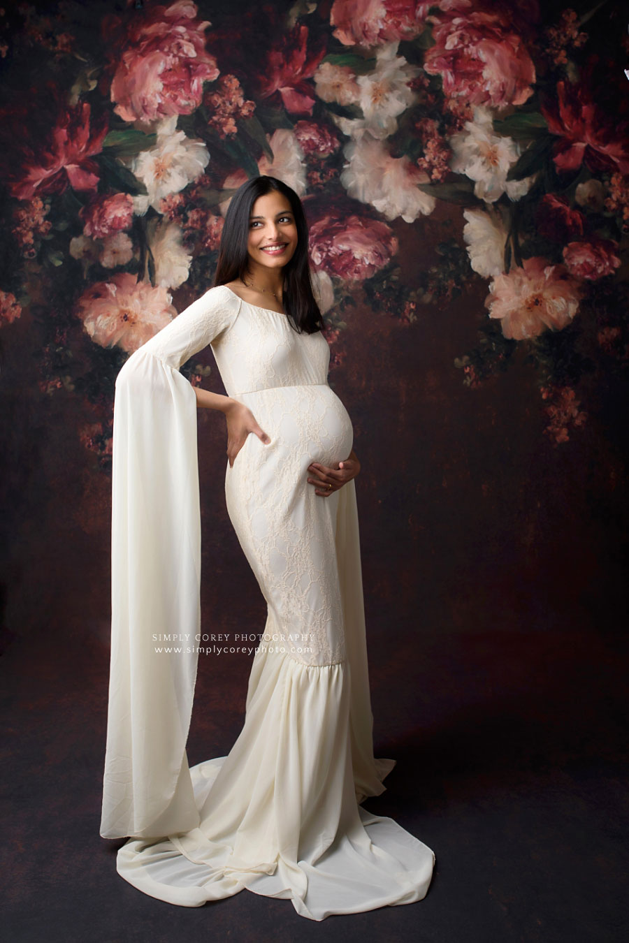 Villa Rica maternity photographer, studio session with white dress and floral backdrop