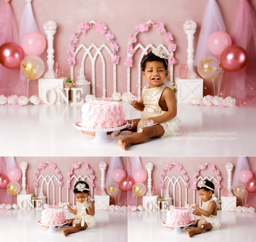 cake smash photographer near Hiram, baby girl eating pink cake