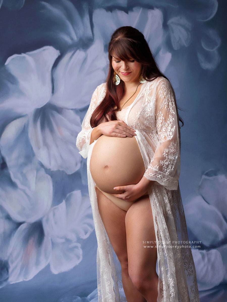 maternity photographer near Douglasville, pregnancy portrait in lace kimono with floral backdrop