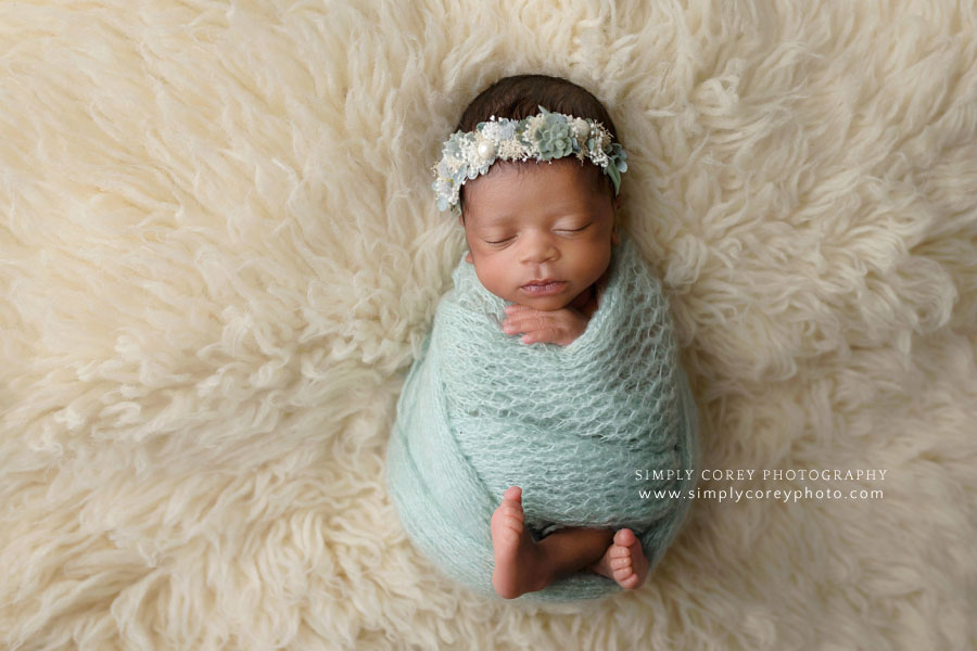 Atlanta newborn photographer, baby girl in mint green knit wrap with flower crown