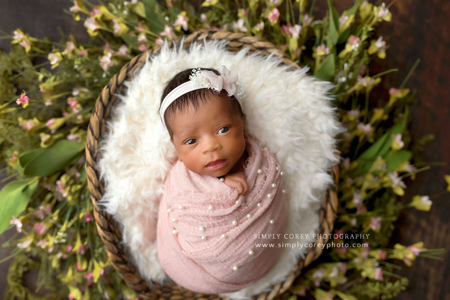 Carrollton newborn photographer in Georgia, baby girl in pink pearl wrap with flowers