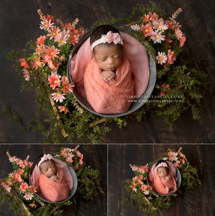 Douglasville newborn photographer, baby girl in studio with coral wrap and flowers