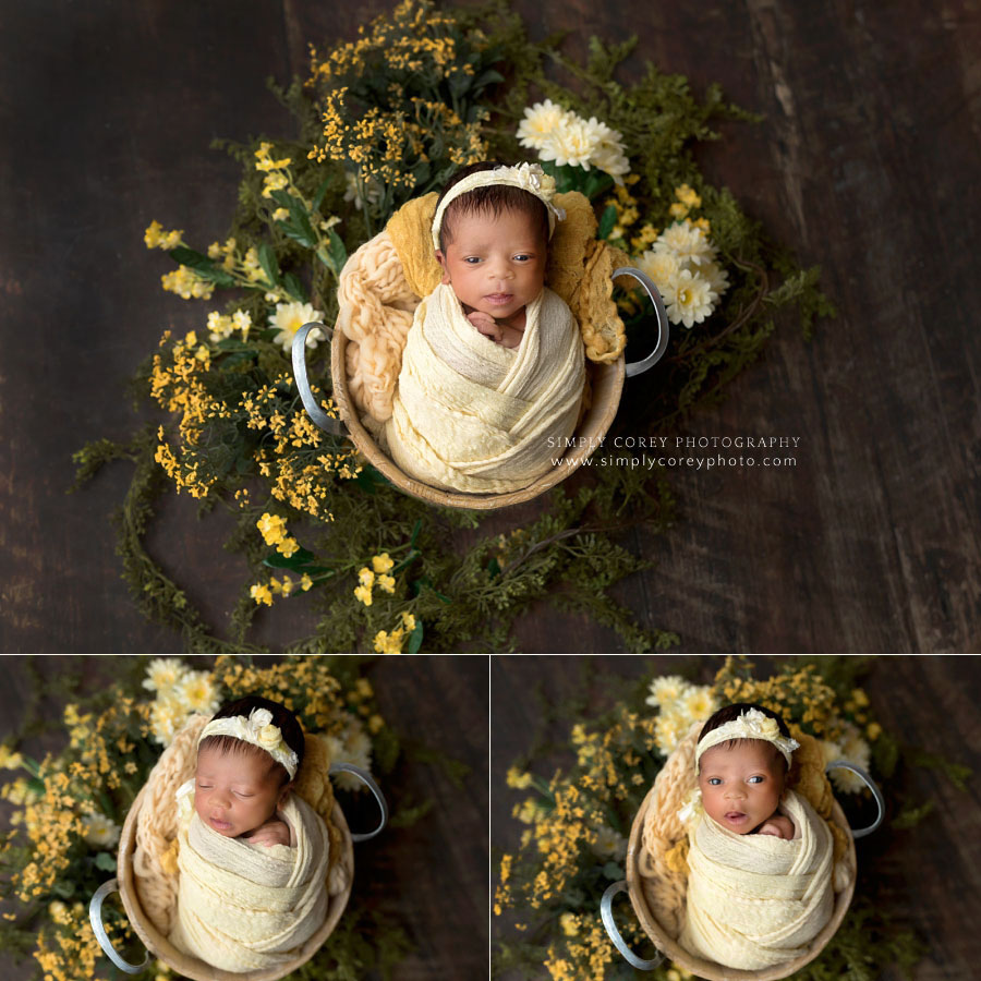 newborn photographer in West Georgia, baby girl in studio with yellow wrap and flowers