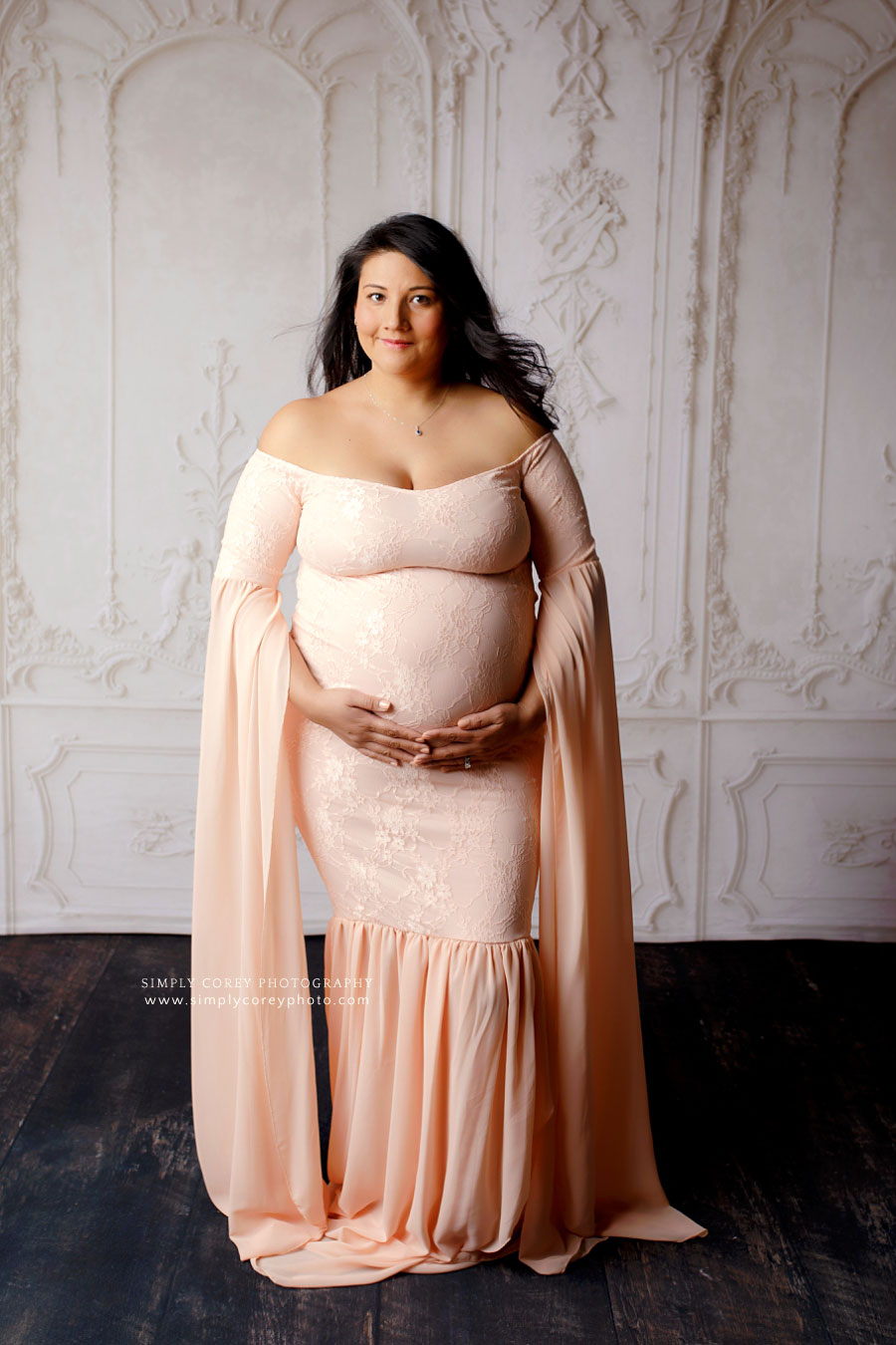 maternity photographer near Villa Rica, studio portrait of expecting mom in long pink dress
