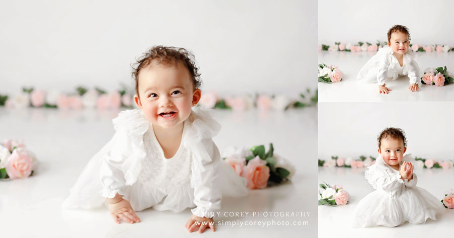 baby photographer near Carrollton, GA; girl on white studio set with flowers