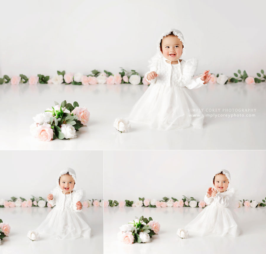 baby photographer near Hiram, girl on white studio set with pink flowers