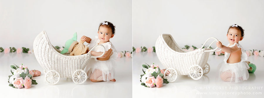 baby photographer near Villa Rica, girl with carriage and baby Yoda during one year session